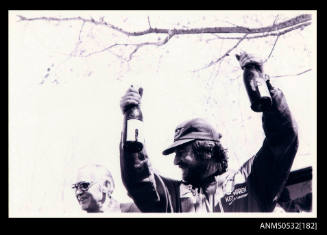 Ken Warby celebrates with champagne