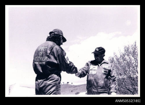 Ken Warby shaking hands with Robert  Apathy