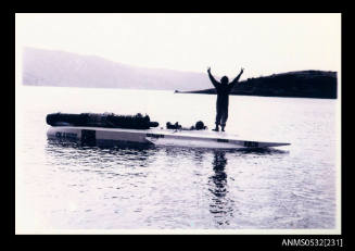 Ken Warby stands on SPIRIT OF AUSTRALIA on Blowering Dam