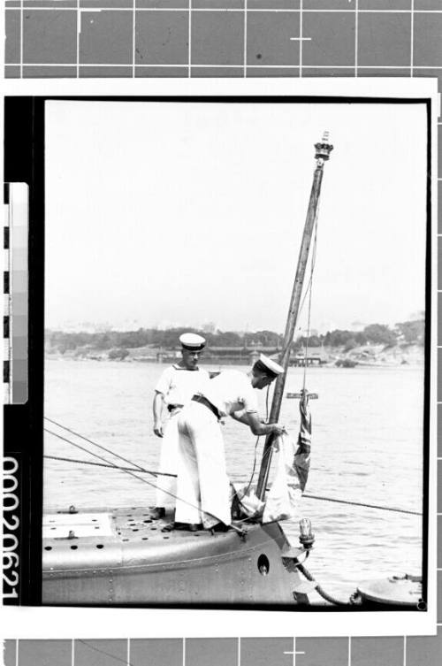 Raising the White Ensign on HMS PHOENIX