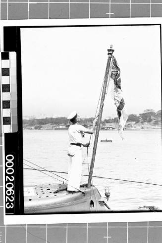 Raising the White Ensign on HMS PHOENIX