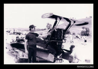 Black power boat with Shell logo on trailer