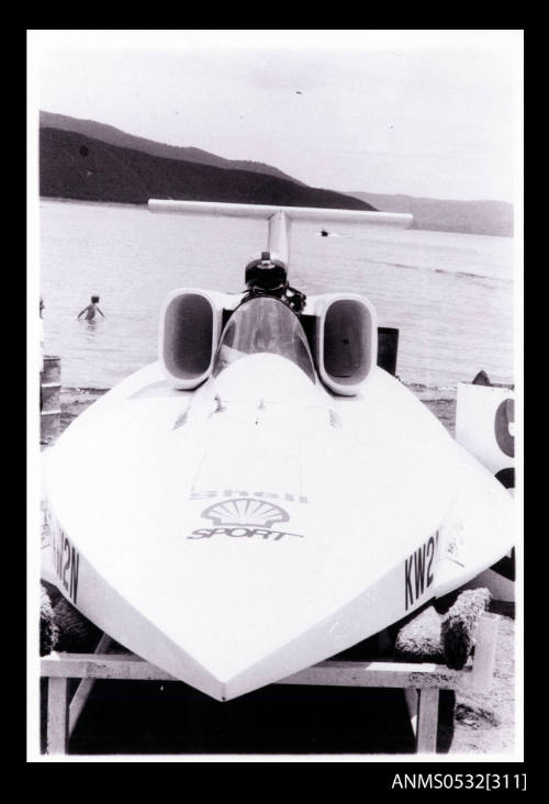 Bow view of speedboat SPIRIT OF AUSTRALIA resting on frame at water's edge