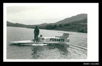 Ken Warby standing on SPIRIT OF AUSTRALIA