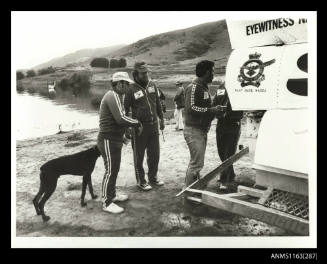 Ken Warby and crew inspect SPIRIT OF AUSTRALIA