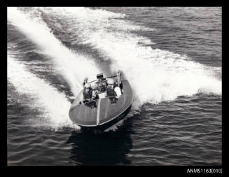 Racing power boat JO-BLOW with driver and co-driver