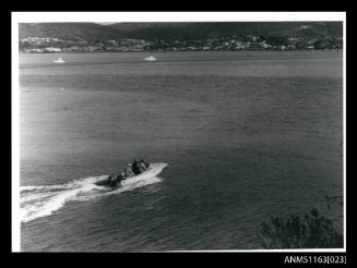 Open power boat at speed with Mercury outboard engine