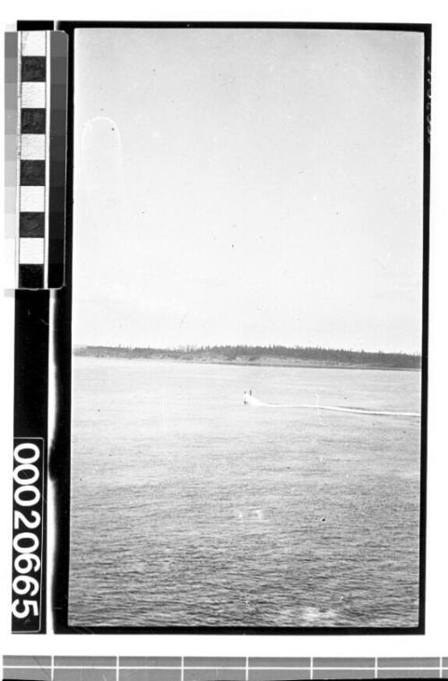 Submarine rising above the water surface