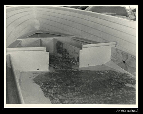 The view of inside fibreglass boat hull looking forard at timber form work