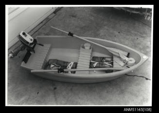 Small dinghy fitted with an Evinrude outboard engine