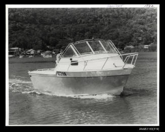 Trail craft half cabin power boat , bow/ starboard side view