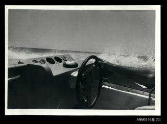 The view from co-drivers seat of a power boats instrument dash board