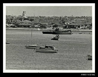 The view of a tug boat, half submerged