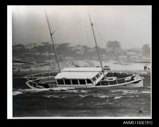 The cabin cruiser power boat with two masts