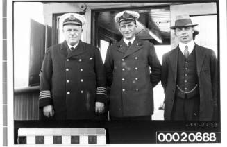Three merchant marine officers, possibly Captain Chrimes, Mr Benjamin and Mr Oslier on TSS EURIPIDES