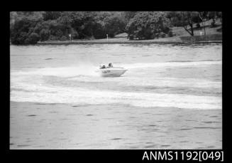 Power boat PRIDE with outboard engine under way