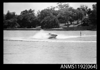 Black and white negative number 19 depicting open power boat with outboard engine bow/ starboard side view at Cabarita Power Boat Races s