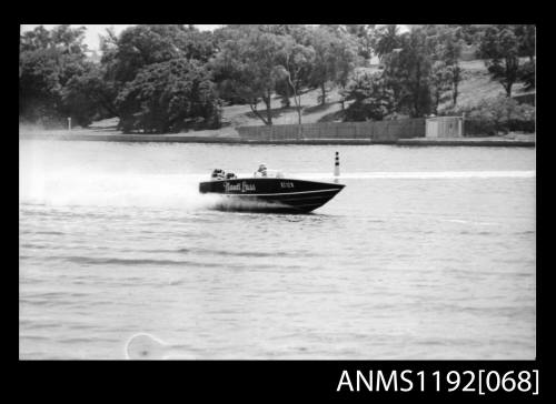 Black and white negative number 25 depicting open power boat NAUTI LASS Kt1twon with outboard engine