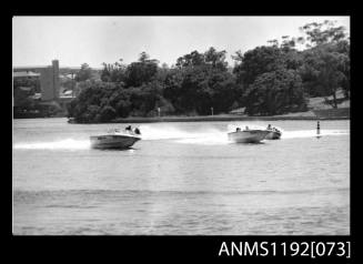 Image depicting image two open power boats with outboard engines