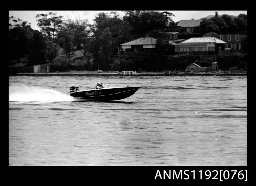 Black and white negative number 34 depicting image open power boat NAUTI LASS , Kt1twon outboard engine