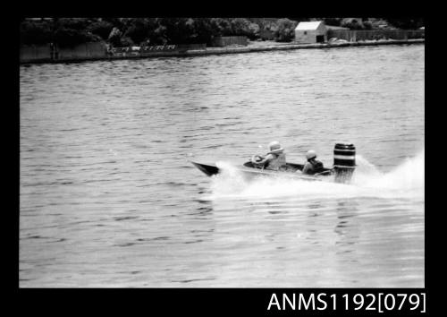 Black and white negative number 36A depicting image open power boat outboard engine