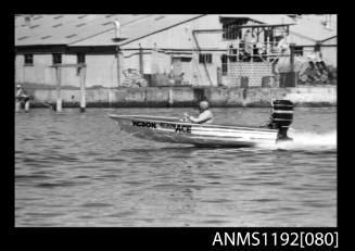 Black and white negative number 4 depicting image open power boat Ace Kc30n outboard engine at speed