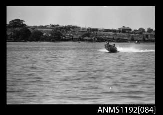 Black and white negative number 8 depicting image open power boat outboard engine at speed