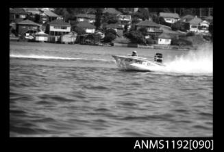 Black and white negative number 14 depicting open power boat Viva , J193n outboard engine at speed