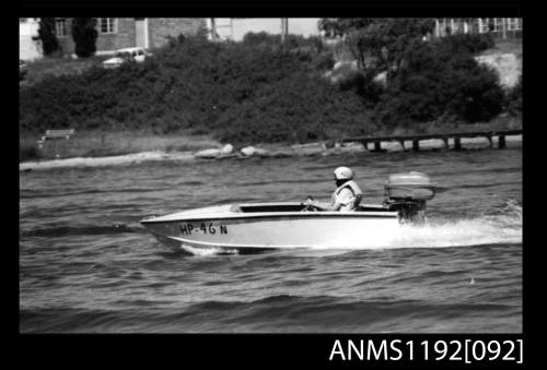 Black and white negative number 16 depicting open power boat Hp46n outboard engines at speed