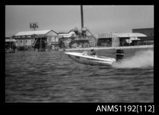 Black and white negative number 13A depicting GOLD POWER , EO69N Racing power boat with outboard engine at speed