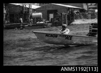 Black and white negative number 14A depicting Ace , Kc30n Racing power boat with outboard engine at speed