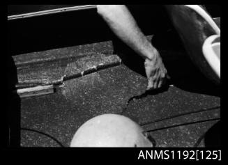 Black and white negative number 26A depicting a hand indicating a break in a boats hull LITTLE HUNTER , Jctwo7n At state sports, pleasure outboard championships, Cabarita, Parramatta River, Sydney, New South Wales