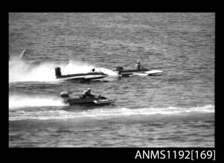 Black and white negative number 33 depicting three power boats including Futwo9 At speed