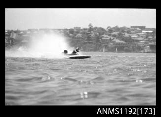 Black and white negative number - depicting power boat completing a turn