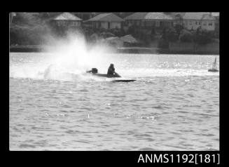 Power boat at speed at Outboard Engined Hydroplane titles, Cabarita, Parramatta River, Sydney