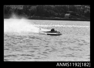 Power boat at speed at Outboard Engined Hydroplane titles, Cabarita, Parramatta River, Sydney