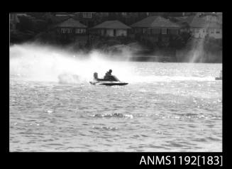 Power boat at speed at Outboard Engined Hydroplane titles, Cabarita, Parramatta River, Sydney