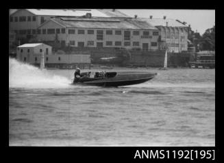 Black and white negative number 7A depicting power boat at speed  starboard side view at Stuart Doyle Gold Cup in New South Wales