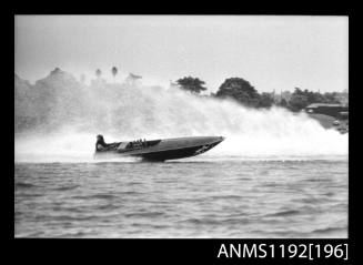 Black and white negative number 8A depicting power boat at speed  starboard side view at Stuart Doyle Gold Cup in New South Wales