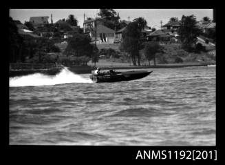 Black and white negative number 13A depicting Maxina , 760N Power boat at speed