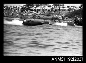 Black and white negative number 15A depicting Maxina 760N Power boat at speed