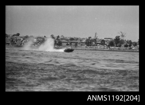 Black and white negative number 16A depicting power boat