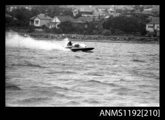 Black and white negative number 1A depicting power boat at speed  starboard side view at Stuart Doyle Gold Cup in New South Wales