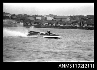 Black and white negative number 2A depicting power boat Ep6n , TABOO At speed