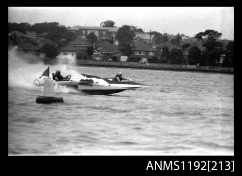 Black and white negative number 4A depicting two power boats at speed abreast