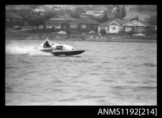 Black and white negative number 5A depicting power boat at speed  starboard side view at Stuart Doyle Gold Cup in New South Wales