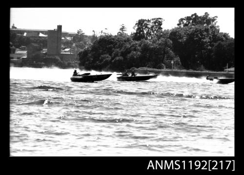 Black and white negative number 8A depicting two power boats Hjin And JO-BLO Under way