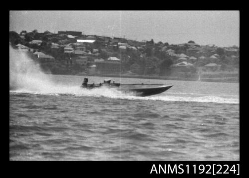 Black and white negative number 16 depicting power boat at speed  starboard side view at Stuart Doyle Gold Cup in New South Wales