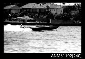 Black and white negative number 12 depicting two power boats 340N And Hjin , Neck to neck