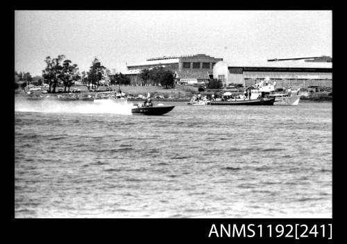 Black and white negative number 13 depicting JO-BLO , Py5n Power boat at speed